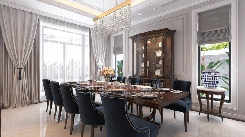 Sắp xếp nội thất phòng ăn gỗ óc chó tân cổ điển đẹp, sang trọng từ bàn gỗ nguyên khối, ghế bọc nệm cao cấp, kệ, tủ kệ trang trí.